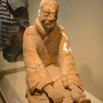Painted Terracotta figure of a sitting archer cocking his bow, Qin Dynasty
