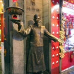 This bronze greeter invited customers into his store.