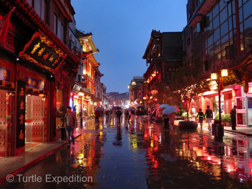 As the sun went down, the lights came up and the beautiful lanterns added to the reflection on the rain-dampened streets.