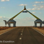An appropriate monument of camels spans the highway toward Ulaanbaatar, the capital of Mongolia.