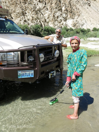 We were shocked when this young girl waded out into the creek and took the brush from Gary's hands.