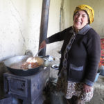 Cooking at Masha’s home is done on an old metal stove in an outside porch. The small stove is moved inside in winter and may be their primary source of heat.