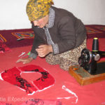 Masha’s mother sews many of her children’s clothes on a hand-crank sewing machine.