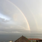 We had never seen a full double rainbow over the ocean. Where was our wide angle lens????