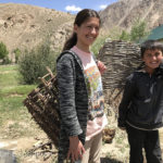 Masha and her cousin are demonstrating hay carrying baskets.