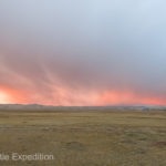 The entire sky took on a tangerine glow, reflecting off the dusting of snow that had fallen during the night.