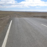 There were short sections of pavement that appeared for a mile or two in the middle of nowhere, but they ended very abruptly with a sharp drop-off back to the dirt washboard.