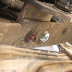 By chance, I had some similar bolts in my emergency-it-will-never-be-needed repair box and we were back on the road.