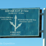 Hey!! A sign we could read. Olgii just 211 kilometers away.