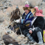 Competitors sat with their eagles to wait their turn in the games.