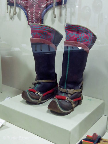 The classic Mongolian boots with toes turned up.