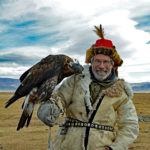 Gary smiles while he kept his face a safe distance from the beak of this powerful bird. It was a special moment.