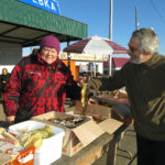 The friendly lady selling smoked omul was happy to pose for a picture.