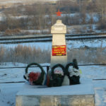 We think this is a Monument to a WW II soldier along side the road. A Russian friend just sent the translation: With memories, a soldier stays alive.