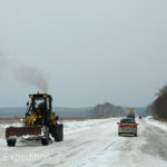 Snowplows were working to keep the road clear but the surface was still treacherously icy with hard packed snow.