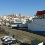 Vehicles are being loaded into the belly of the Eastern Dream DBS Cruise Ferry bound for South Korea.