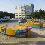 South Koreans are avid fishermen. These fish cleaning stations at the beach were handy. You can spot The Turtle V in the background.