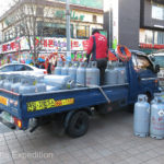 Everyday life - a truck exchanging propane tanks.