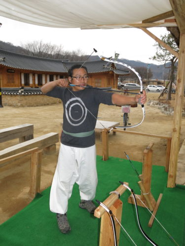 Nam Hee-Jong demonstrates his Yechon bow. He is a member of the Traditional Military Honor Guard.