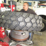 Michelin XZL 335/80R20s are mounted on custom 20X11 Rickson steel wheels. The SmarTire sensor was preinstalled.