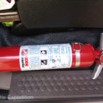 On the side of each seat a Kiddy Safety Halotron fire extinguisher is securely mounted.