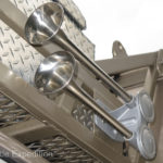 Twin Fiamm stainless steel marine air horns mounted above the cab are an international language.