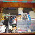 The top drawer is used for general stationary; batteries, chargers, paper, a portable printer and a portable photo printer.
