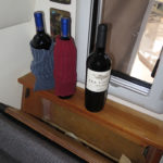Old socks placed around wine bottles makes the compartment behind a seat a wine cellar when it’s not filled with dirty clothes.