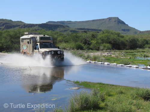 The vados on the new paved road are great free car washes!