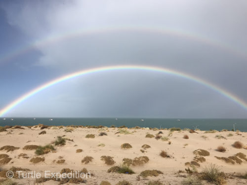 A full double rainbow frames the shrimp boats south of San Felipe as a storm approaches.