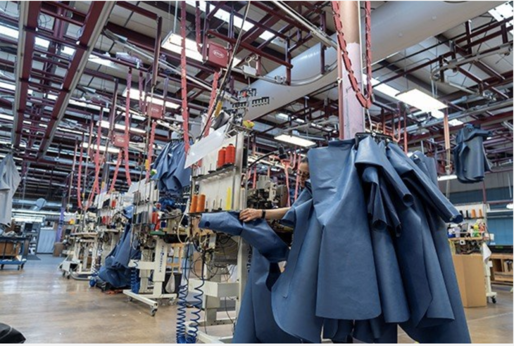 At the Covercraft manufacturing facilities employees are busy sewing protective gear for medical personnel and first responders. © Covercraft